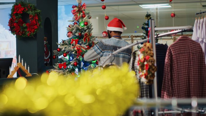Employees decorating clothing store
